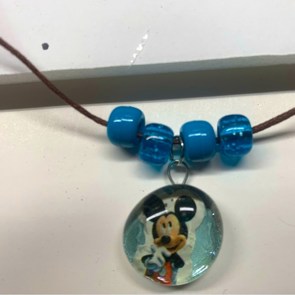 Hand crafted by K.B. Flat glass picture necklaces.All kids kinds this is just 3